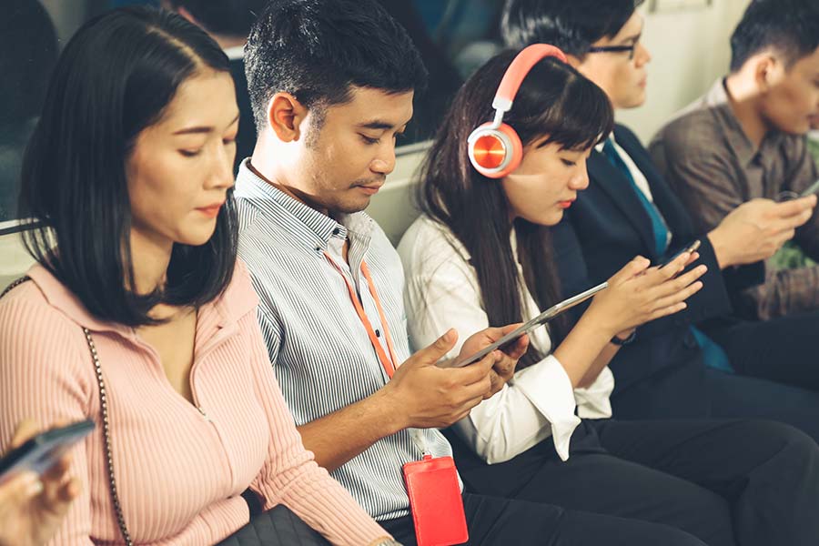 Chinese-people-commuting Chinese people commuting on train looking at their devices
