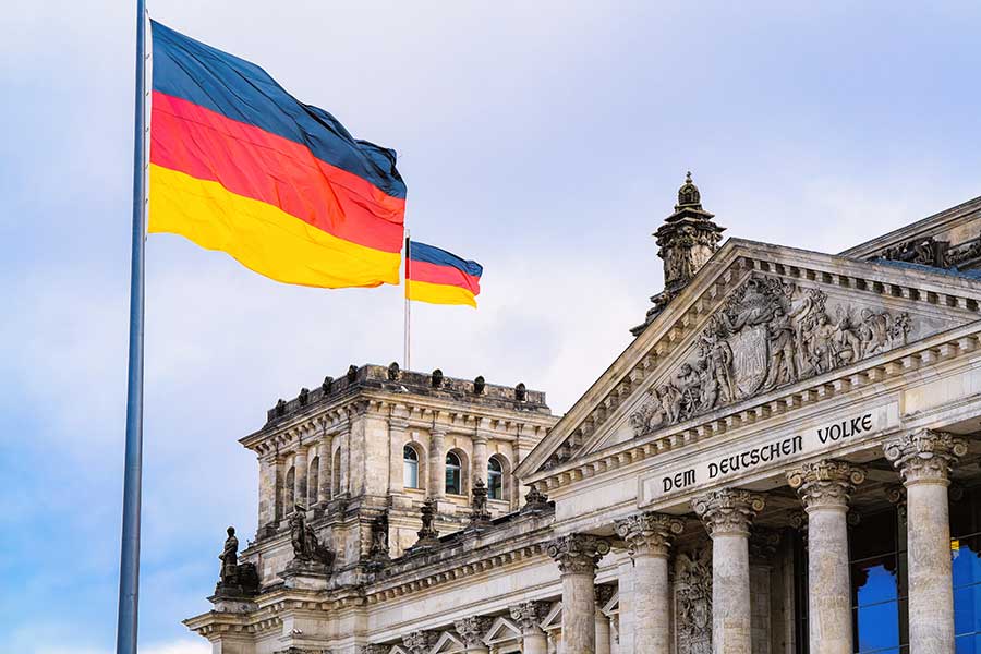 Germany berlin reichstag building of german parliament. Germany flag waving in the wind. 