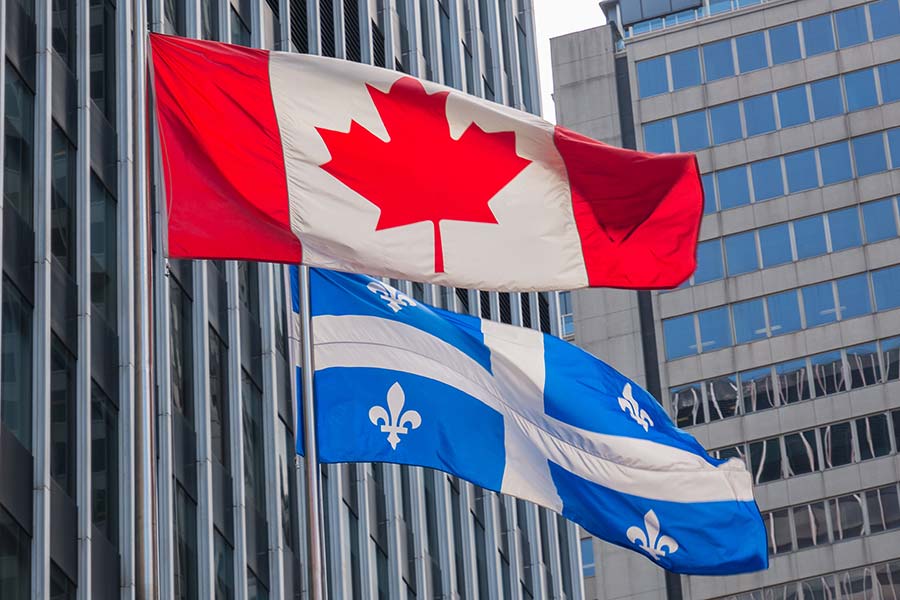 Quebec-and-Canada-Flag Canada and Quebec flags representing French-to-English translation services