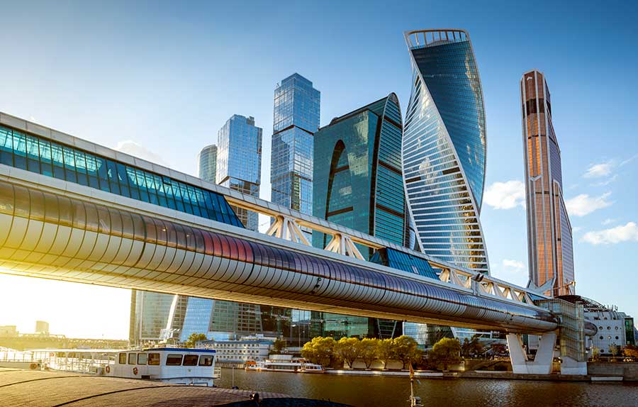 Moscow International Business and Financial Center and rail line. Modern buildings with a sunset behind.